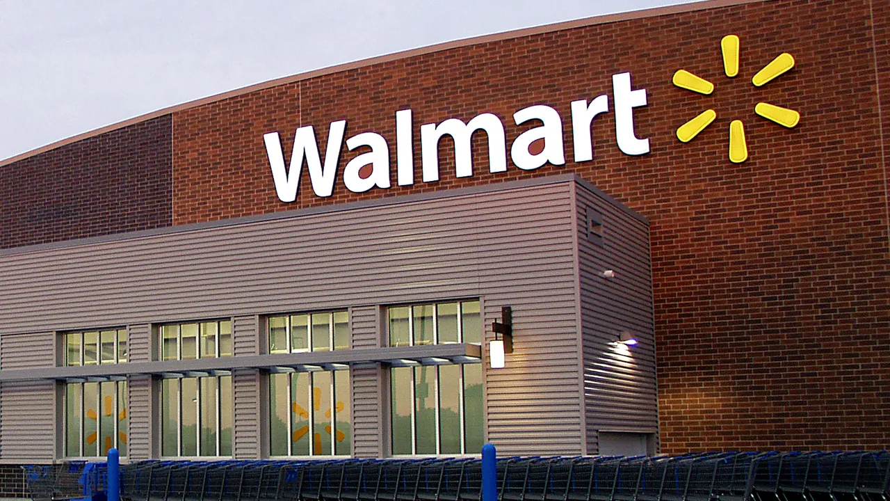 The front of a Walmart store with the company’s name above the entrance